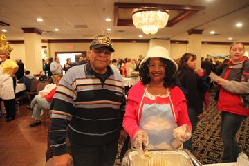 LaVerne Bly and her husband, Leon, of Center Barnstead spoon out some of their traditional mac and cheese.