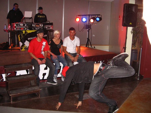 A breakdancer entertains the crew between sets.