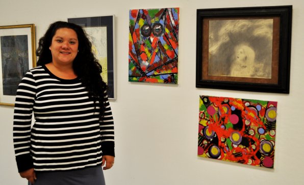 Beryl McCormack with some of her work at the NHTI Visual Arts capstone exhibit.