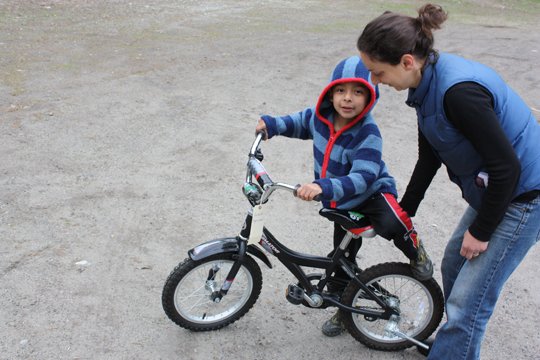 Erika Feldman gets ready to send son Pablo Gorenstein, 5, out on a bike.