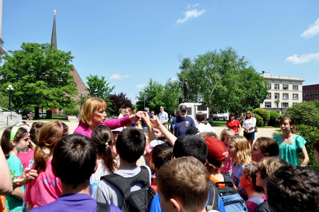 Gov. Maggie Hassan offers high fives to the children who participated in Friday’s Granite Walk of Ages, a health initiative to get all ages walking. The walk began at White Park and ended at the State House.