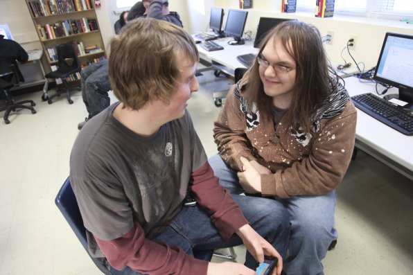 Isaac Ladd and Phillip Jewell, both 18, take a break from their studies to play a round of Angry Birds. “I don’t run into the same roadblocks because it’s just me doing the learning,” said Jewell of the CSI Charter School. “You’re judged on the work that you do . . .”