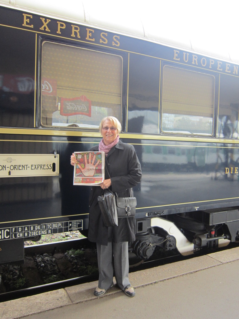 Linda Fanny of Concord boarding the Orient Express in Prague with her Concord Insider.