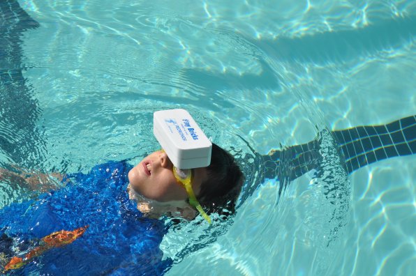 Brick races required the swimmers to move from end of the pool to the other with a foam brick on their head. James LeMahieu was one of few to master the technique of swimming backwards with it on his forehead.