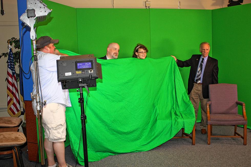 From left: Chris Gentry, Matt Newton, Emily Newton and Van McLeod mess around with the green screen at ConcordTV's Heights Community Center studio. The result was floating heads appearing on the screen. (JON BODELL / Insider staff) - 
