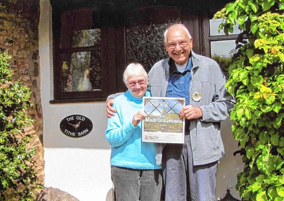 Vince and Jackie Bonjorno sure were nice to not only bring us along for their trip to the United Kingdom in May, but they also included us in this picture with them in front of the Old Tithe Barn in Nomansland, Tiverton, Devon, U.K. You should also bring us along on your next vacation, take a picture with a recent edition of the paper and email it to news@theconcordinsider.com, and we’ll put it in a future issue. (Courtesy photo) - 

