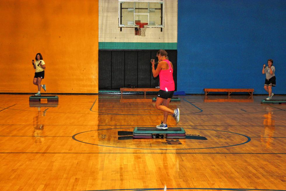 Bonnie Larochelle masters the stairmaster during her aerobics class at the YMCA. Nice form! (JON BODELL / Insider staff) - 
