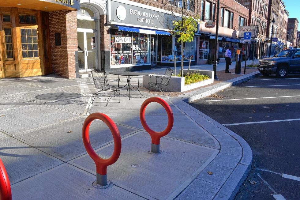 What in the world are those ring things? No, they’re not gymnastics equipment. What they are is bike racks. Now with the new bike lanes on the street, it wouldn’t be prudent not to have new places to lock those bikes up, would it? (TIM GOODWIN / Insider staff) - 
