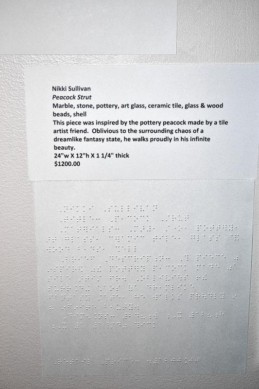 This is what of the information cards looks like, complete with braille. (TIM GOODWIN / Insider staff) - 
