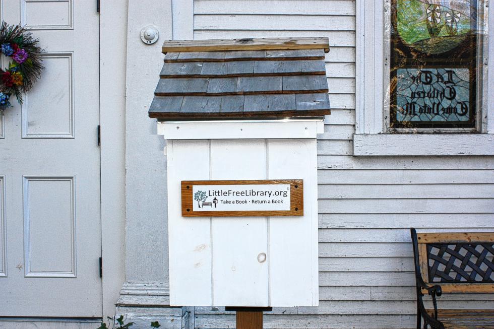 The Little Free Library at East Congregational Church on Mountain Road sort of resembles the church itself. (JON BODELL / Insider staff) - 
