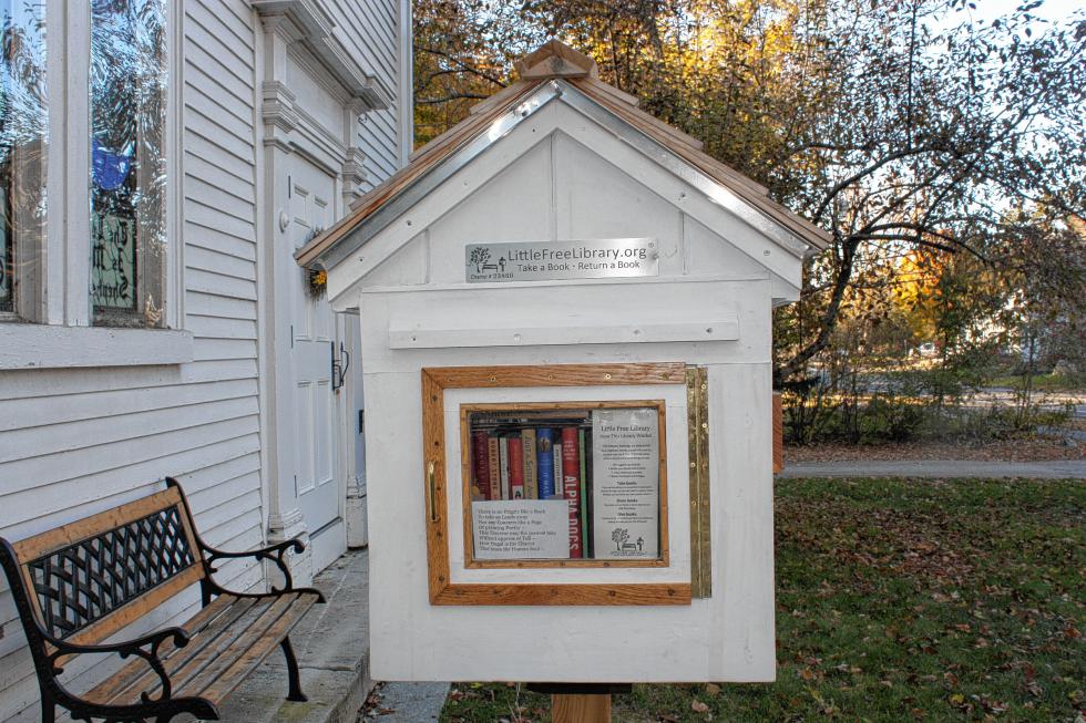 There's a bench right next to the Little Free Library at East Congregational Church. Perfect for sitting down with a nice read after Mass. (JON BODELL / Insider staff) - 
