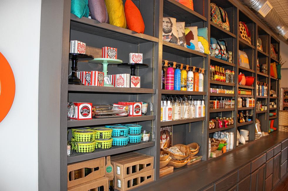 The big shelf across from the check-out counter at Fifty Home features tons of colorful and useful products for the home. (JON BODELL / Insider staff) - 
