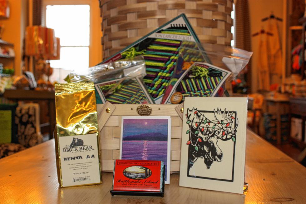 A collection of New Hampshire-made items at Fifty Home includes coffee, soap, a basket, some yarn and some postcards. (JON BODELL / Insider staff) - 
