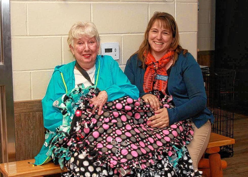 The Chapter B Concord P.E.O. (Philanthropic Education Organization) for Women recently donated 11 fleece blankets to the Pope Memorial SPCA. The blanket donation idea was that of member Lin Mikesell (pictured above with Shannon Camara, director of special events and educational outreach for the Concord SPCA) and the work of tying the blankets together was done by the Chapter B ladies at their recent monthly meeting. (WENDY RAMSEY / For the Insider) - 
