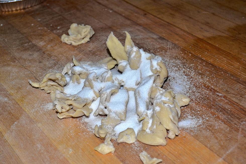 That pile of stuff is uncooked pie crust edges and sugar that will soon be crumb topping. (TIM GOODWIN / Insider staff) - 
