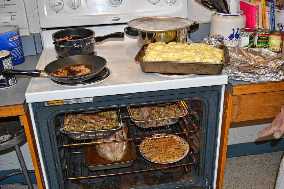 There’s not a lot of room left in that oven or on the stove top. (TIM GOODWIN / Insider staff) - 
