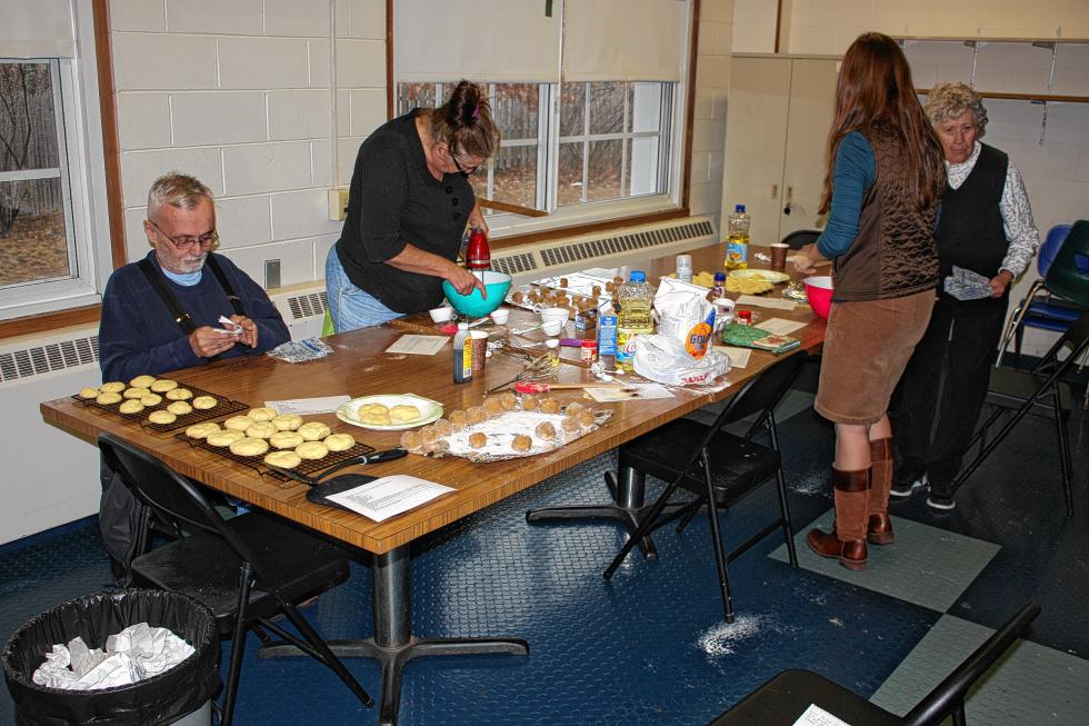From left: Wesley Shute, Shirley Blad, Concord Parks and Recreation Program Coordinator Kari Inglis and Carol Forbush work on some cookies at the Heights Community Center's Holiday Cookie Madness event last week. It may not look like it here, but it certainly was a day filled with madness – and cookies. (JON BODELL / Insider staff) - 
