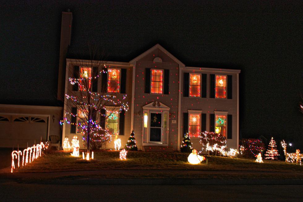 The ground display at this Amy Way house is so bright that you can barely see the laser dots all over the house. They’re there, though. (JON BODELL / Insider staff) - 
