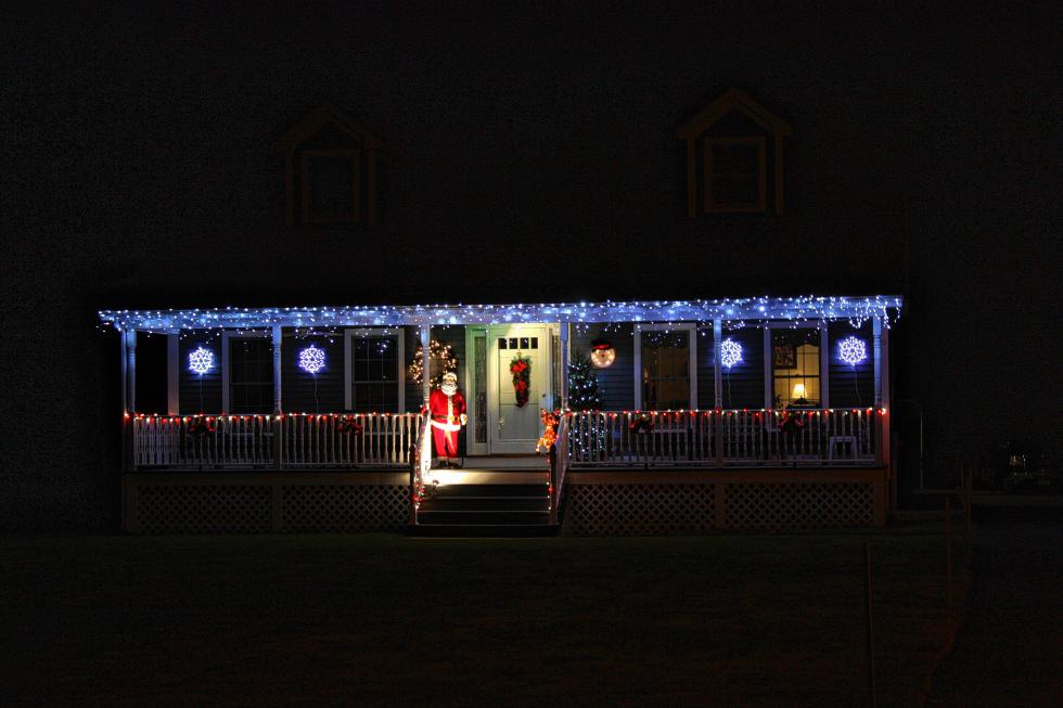 This house on Mountain Road is pretty eye-catching. The blue icicles pierce through the night sky, and that life-size Santa on the porch looks shockingly realistic from the street. (JON BODELL / Insider staff) -