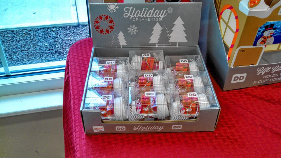 The Dunkin' Donuts on Whitney Road has a drive-thru, an okay selection of donuts, no seating and a decent selection of merchandise, including these handy Christmas tree ornaments. (JON BODELL / Insider staff) - 
