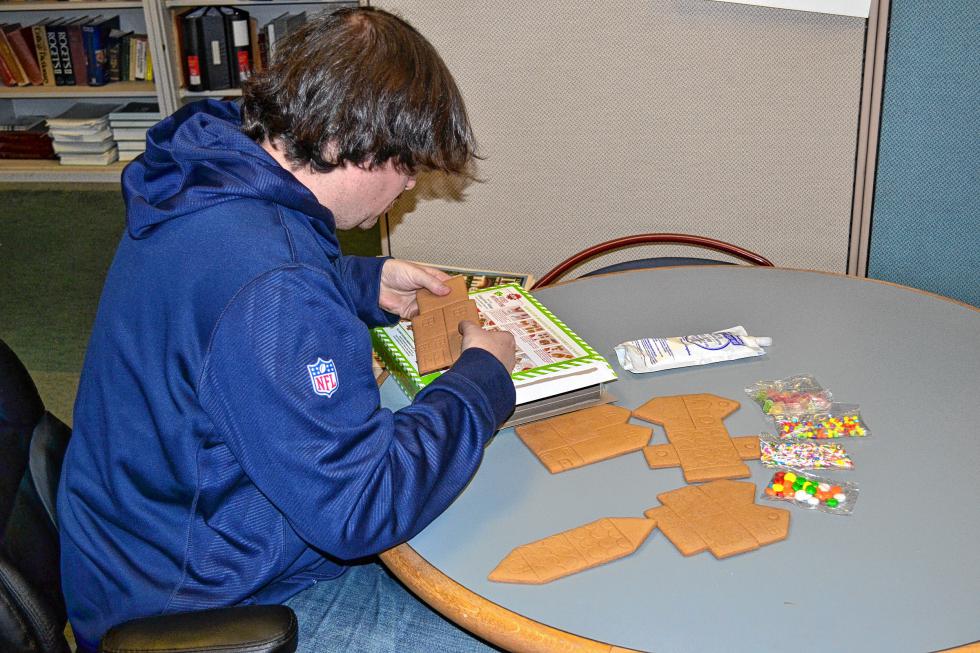 Tim carefully breaks some of the pieces. (JON BODELL / Insider staff) - 
