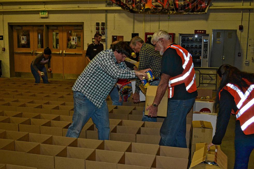 Here’s actual proof that I put canned goods in lots of boxes at the Capital Region Food Program’s Holiday Basket Project last week. (LEE LAJOIE / For the Insider) - 
