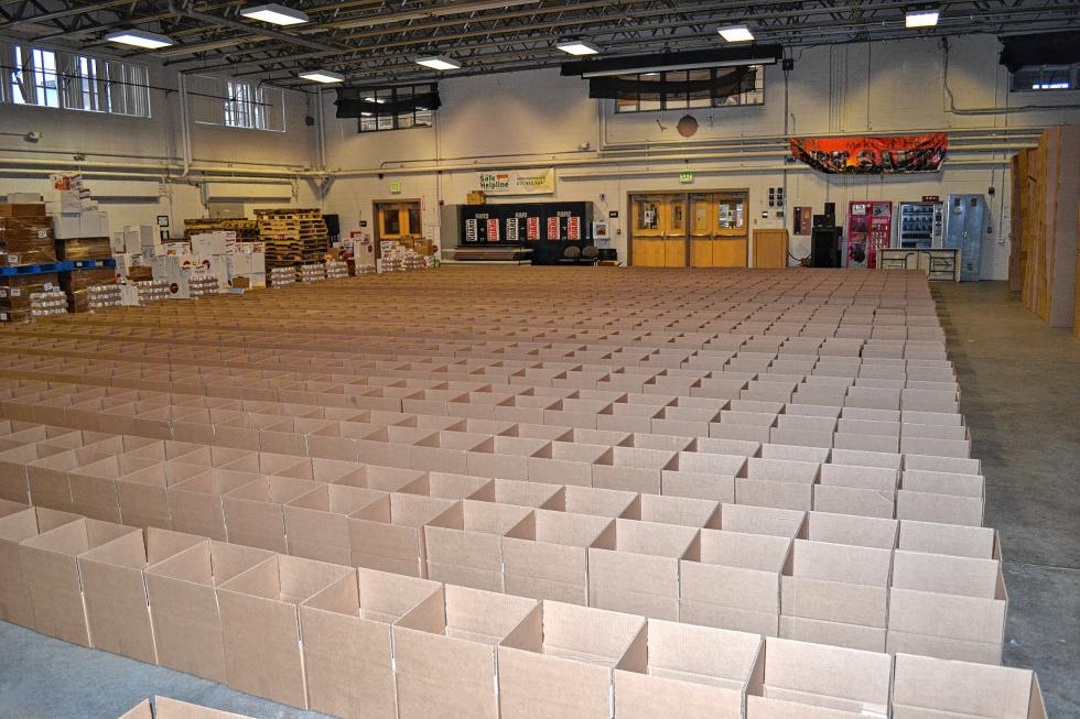 Look at all those boxes for the Holiday Food Basket Project and that's only a quarter of them. (TIM GOODWIN / Insider staff) - 
