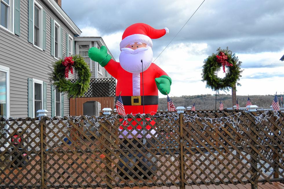 1. Nothing says the holiday season like a giant inflatable Santa flanked by a couple wreaths. And you can spot this one outside a downtown business that serves up tasty slices of pie – the one created in Italy and not the dessert one. - 
