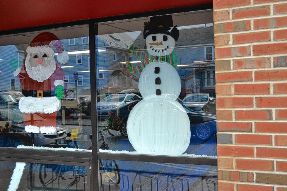 3. Sure, you can buy decorations for your windows, but true holiday enthusiasts make their own, and in this case paint them on the window of the place that village people like to go to. - 
