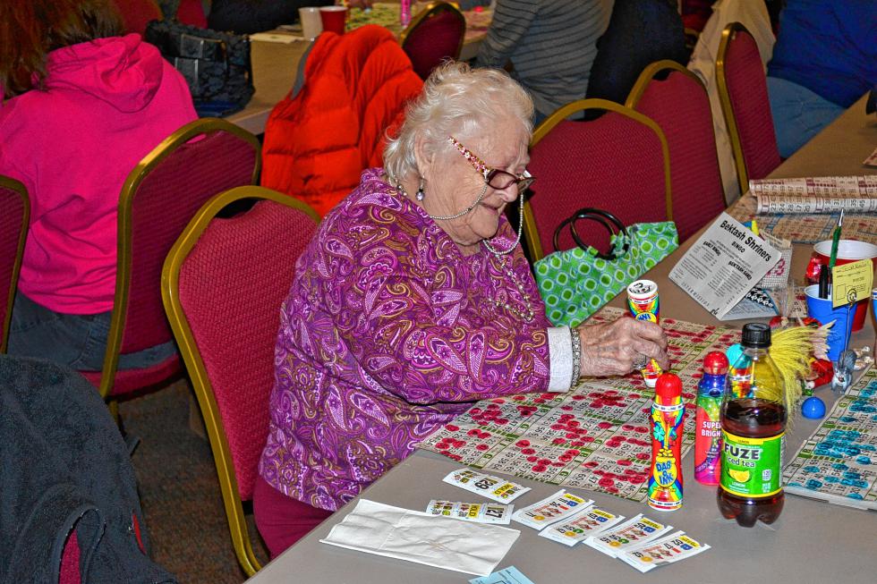 Polly Croteau enjoys the early bird games at last Thursday’s weekly bingo get together. (TIM GOODWIN / Insider staff) - 