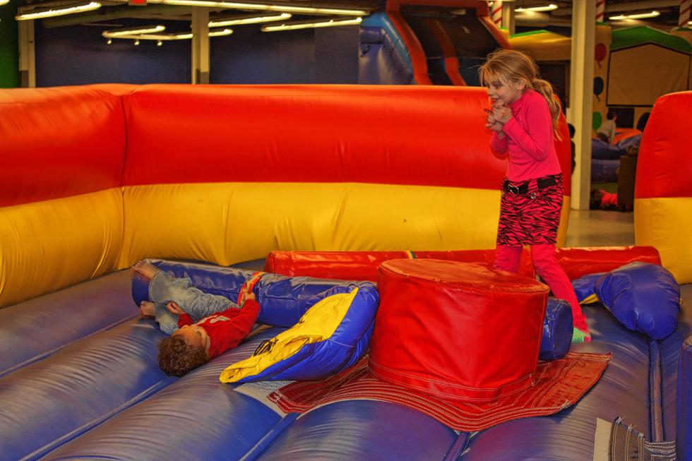 Tiana Alleyne (right), 7, plays in the bouncy boxing ring with Cayden Miller, 3. Nobody was knocked out during the match. (JON BODELL / Insider staff) - 
