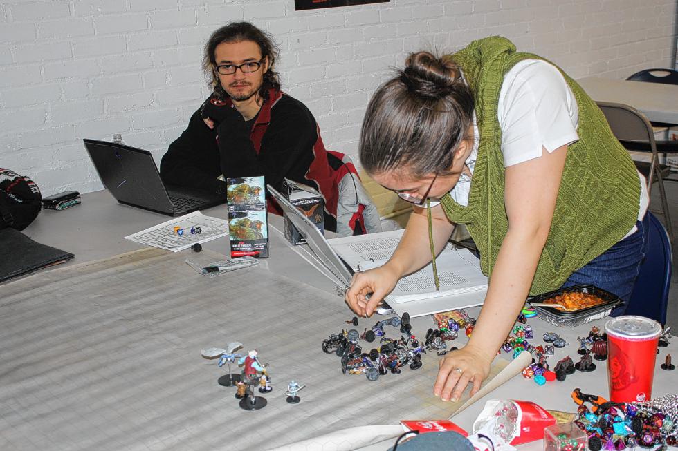 Amanda Jones sets up a game of Dungeons and Dragons at Double Midnight Comics in Concord last week. (JON BODELL / Insider staff) - 