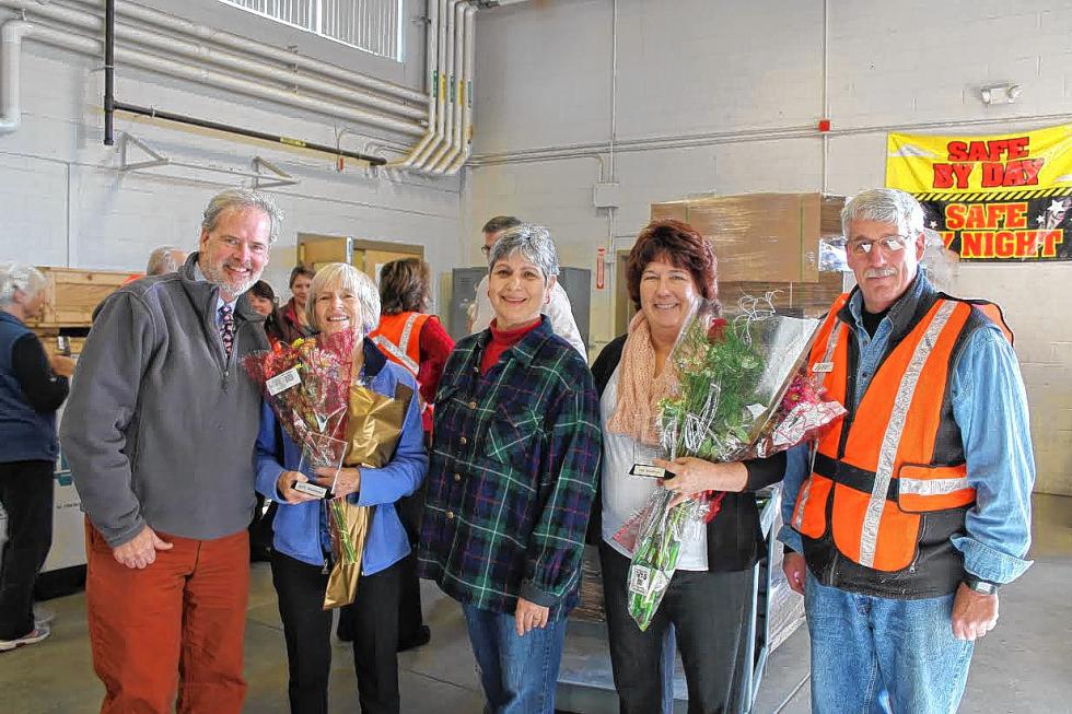 The Capital Region Food Program named Debra Bourbeau of Bow (second from right) and Jackie Whatmough of Concord (second from left) as their 2015 Volunteer Hero Award winners at the 42nd Annual Blessing of the Baskets ceremony at the National Guard Armory. The Volunteer Hero Award was established in 2008 and recognizes those who have provided extraordinary service to the organization over a long period of time, who strongly believe in the mission of the Capital Region Food Program and who have demonstrated the ability to secure support for the program from the community. Pictured with Whatmough and Bourbeau, who have supported the program for more than 35 years combined, are First Gentleman Tom Hassan, Maria Manus Painchaud (Holiday Food Basket chairwoman) and Peter Hayden (Capital Region Food Program board chairman). This year’s Holiday Food Basket project distributed more than 4,000 boxes of food that fed 2,136 families in 18 communities. Visit capitalregionfoodprogram.org to learn more about the Holiday Food Basket Project, how to volunteer with the program and to find a list of partner agencies supported by their efforts. (JILL TEETERS / For the Insider) - 
