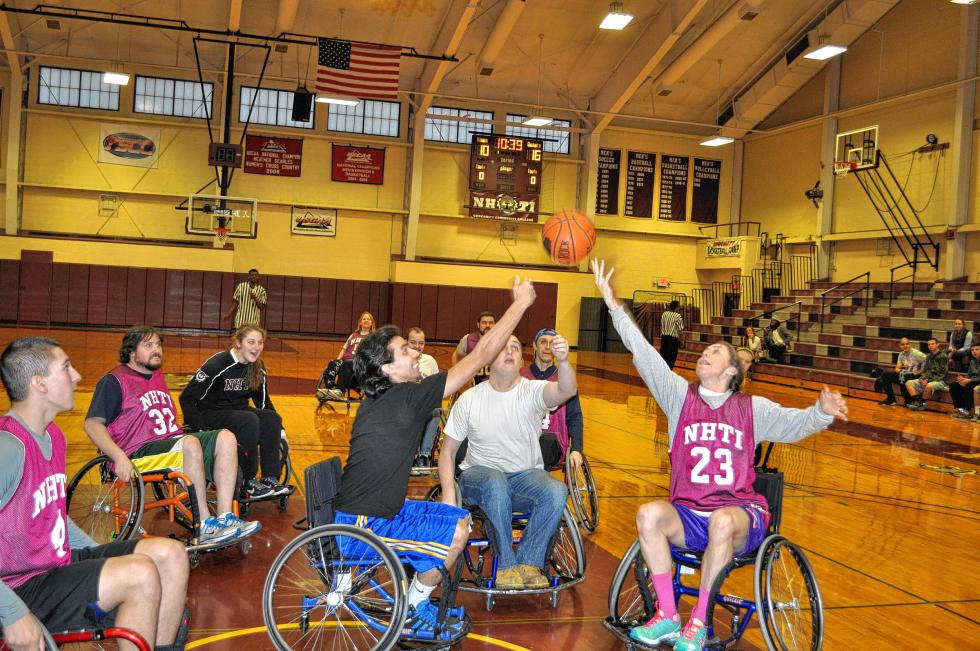 NHTI will host its annual Wheelchair Basketball Benefit on Feb. 3 to help purchase assistive technology for students with disabilities. And in case you didn’t notice, that’s Tim, second from the left, playing last year. (Insider file photo) -
