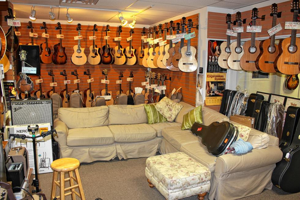 Plenty of excellent choices in the cushy acoustic room at Strings and Things. Looking for a Martin? Taylor? What about a really nice banjo? And nice comfy couches to sit and play on? You'll find all of the above in this climate-controlled room. (JON BODELL / Insider staff) -