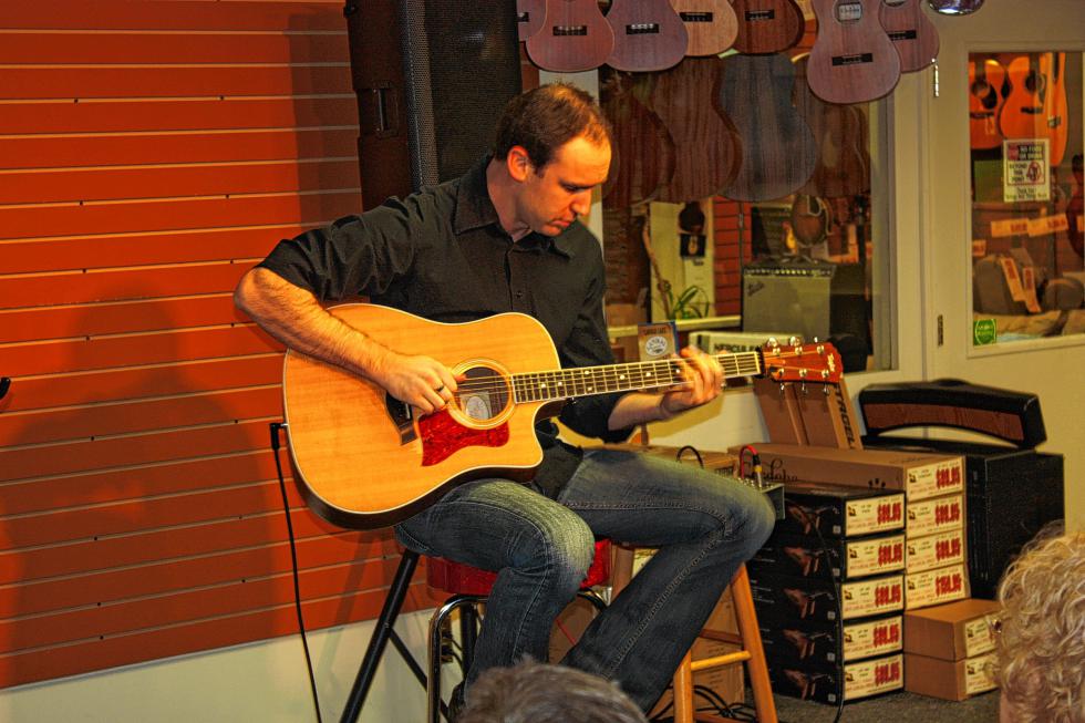 Guitarist Brad Myrick plays during a guitar clinic at Strings and Things music store this past Sunday. (JON BODELL / Insider staff) -