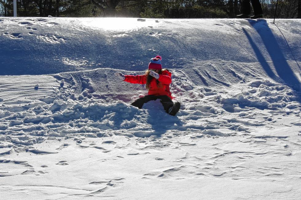 Gabriel Knightly, 8, takes a slide down a slippery slope at Beaver Meadow. (JON BODELL / Insider staff) -