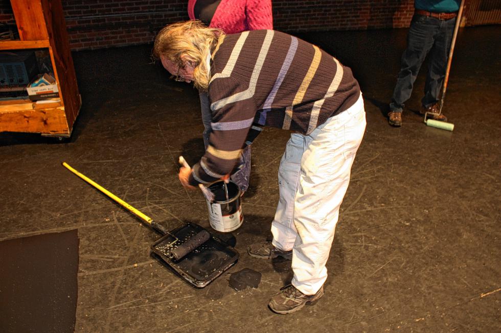 Rudy Douville adds some more paint. It takes about 4 gallons to cover the whole surface, he said. (JON BODELL / Insider staff) -