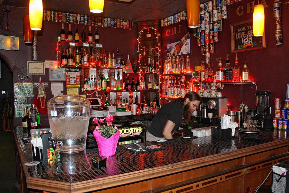 Chi Cha Hookah Bar manager Karl Horner works behind the bar last week. (JON BODELL / Insider staff) -