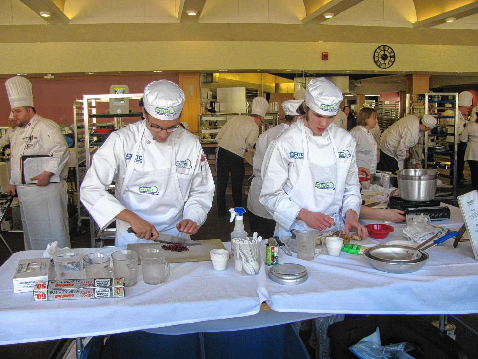 Anthony Costello and Chase Haines do some of the prep work for the three-course meal put together by the CRTC’s culinary arts team at the New Hampshire ProStart cooking competition on March 5. (Courtesy photo) -
