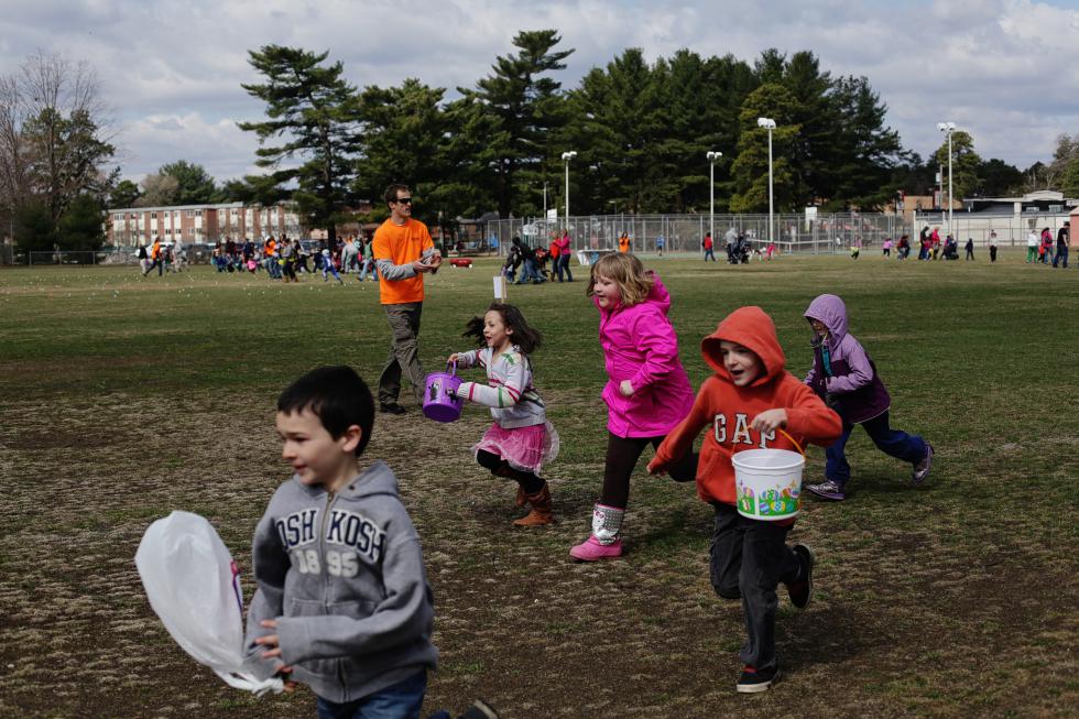 First and second graders take off from the starting line after whistle is blown at the Easter egg hunt at Keach Park in Concord on Saturday morning, April 19, 2014. More than 50 kids attended the event that had 2000 eggs split up into four different hunts based on age groups.   (ANDREA MORALES / Monitor staff) - Andrea Morales | Concord Monitor