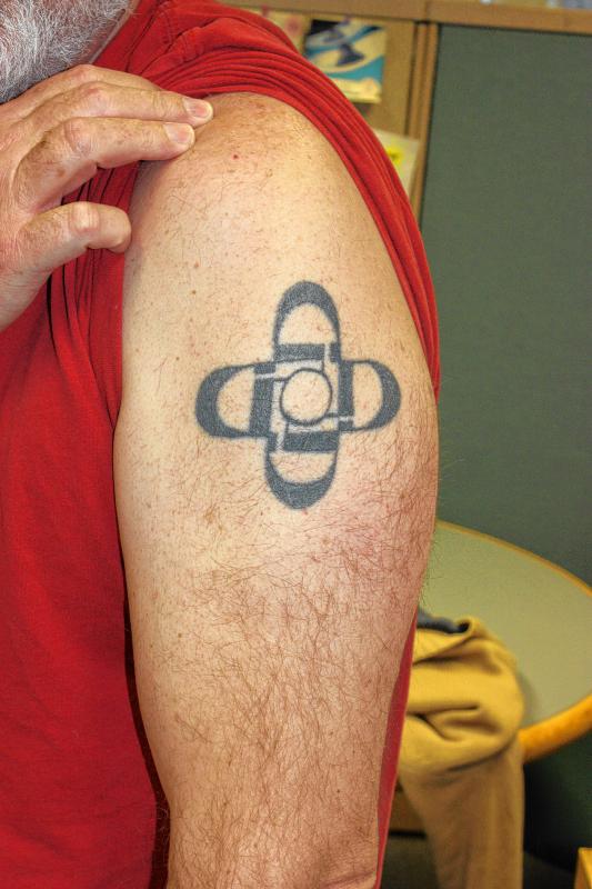Goeff Forester, photo editor: My tattoo is a cross that means everywhere you look is God. My son found the design for me. I got it done at Gothic Tattoo on Loudon Road in 2009. It's my only tattoo.  (JON BODELL / Insider staff) -
