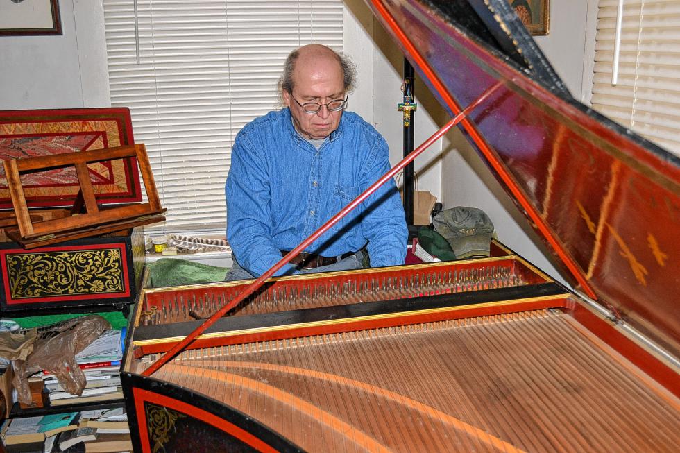 R.P. Hale tickles the keys on his grand harpsichord. Hale made the instrument you’re currently looking at. (TIM GOODWIN / Insider staff) -