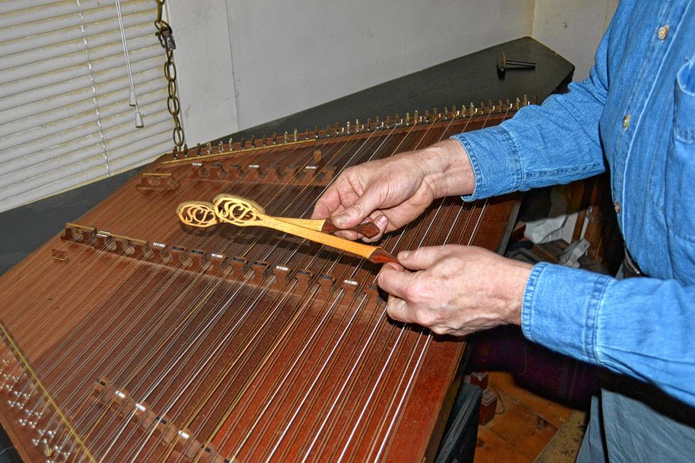 Just look at Hale play the hammered dulcimer. (TIM GOODWIN / Insider staff) -