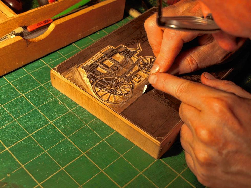 Hale working on the wood engraving for Concord 250. (Courtesy photo) -