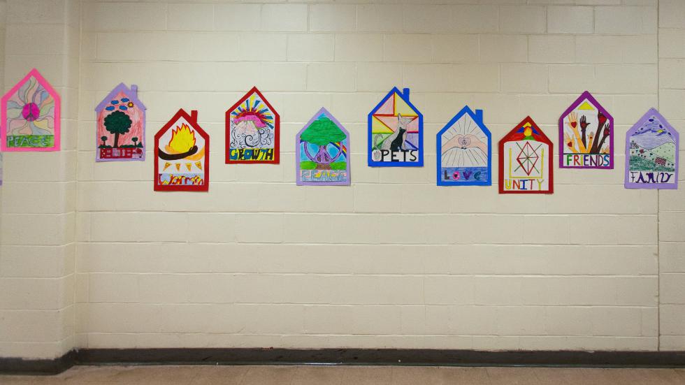 Artwork expressing the concept of home, made by Rundlett Middle School students, adorns the hallways during SouperFest, a community event held at Rundlett Middle School in Concord to benefit the Concord Coalition to End Homelessness, on Saturday, March 28, 2015.  (ELIZABETH FRANTZ / Monitor staff) - ELIZABETH FRANTZ | Concord Monitor