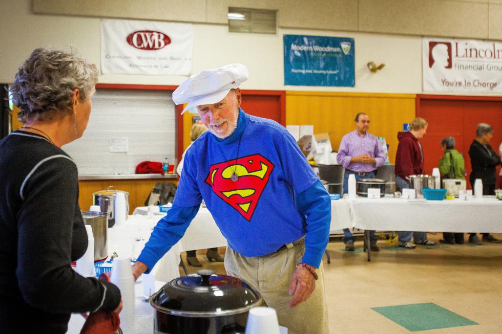 Event chair James Kinhan helps with soup station set up during SouperFest, a community event held at Rundlett Middle School in Concord to benefit the Concord Coalition to End Homelessness, on Saturday, March 28, 2015.  (ELIZABETH FRANTZ / Monitor staff) - ELIZABETH FRANTZ | Concord Monitor