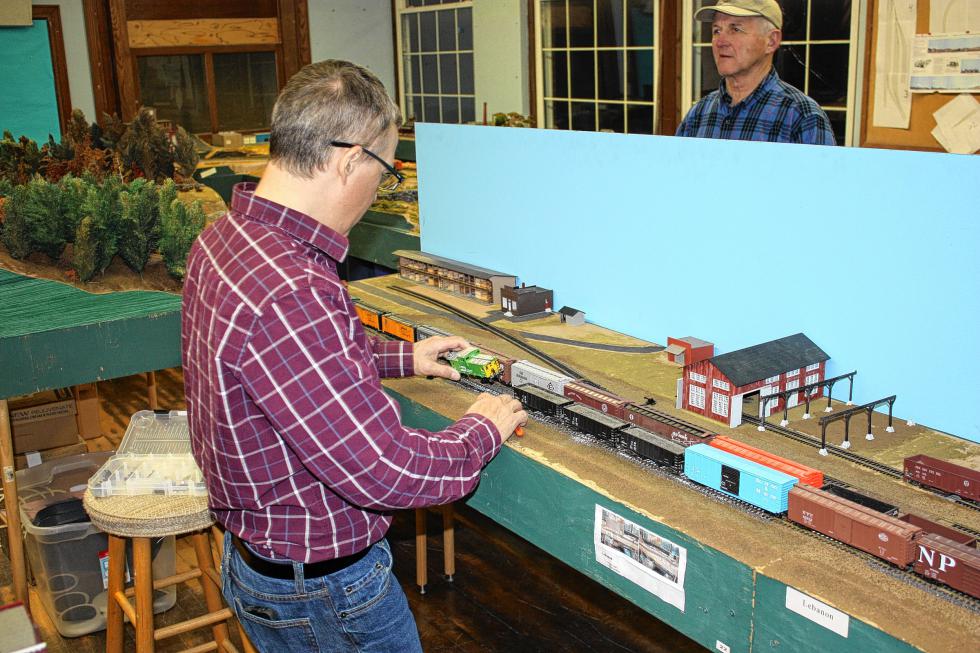 Joe Linquata does a little maintenance work at the Concord Model Railroad club last week. (JON BODELL / Insider staff) -