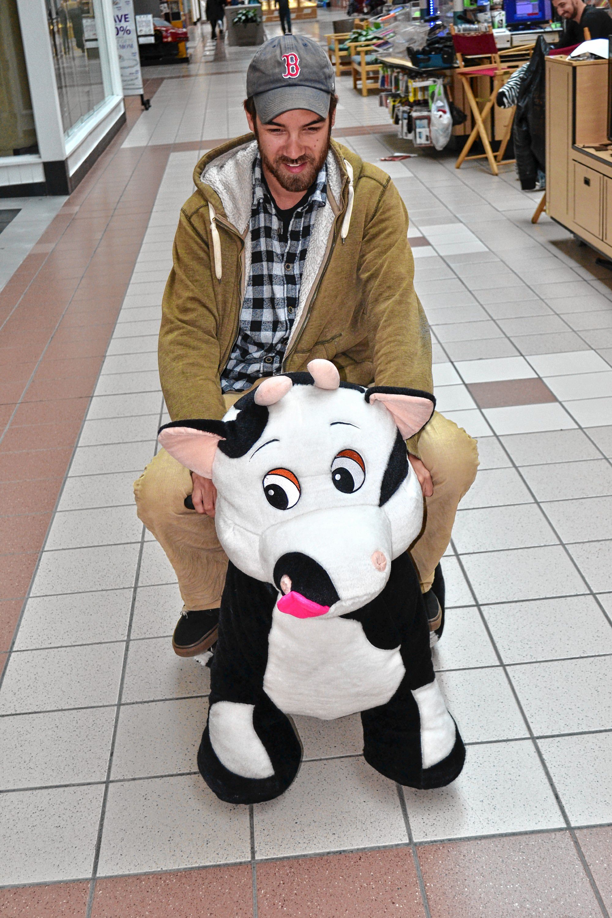 riding stuffed animals in mall