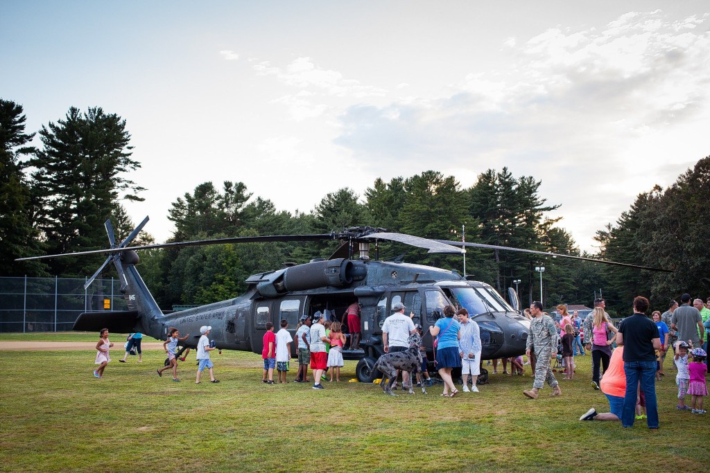 ELIZABETH FRANTZ / Monitor filePeople wait in line to get a closer look at a New Hampshire Army National Guard blackhawk helicopter during last year's National Night Out event hosted by the Concord Police Department at Rollins Park in Concord.